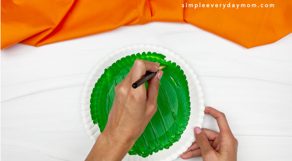 hand painting paper plate green