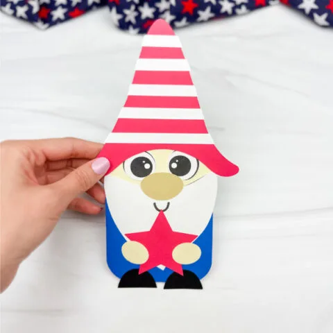hand holding finished patriotic gnome craft