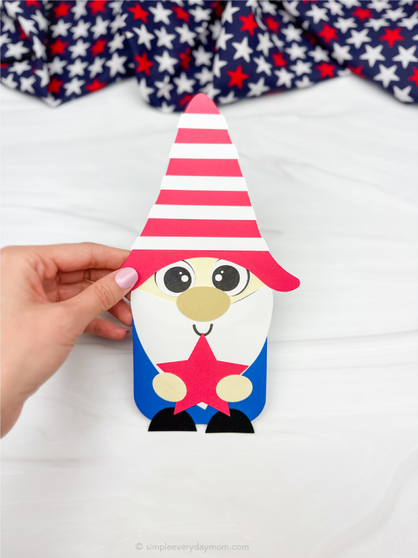 hand holding finished patriotic gnome craft