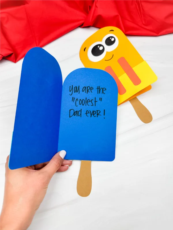hand holding popsicle card craft showing inside of card