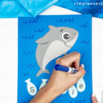 hands using blue marker to create waves