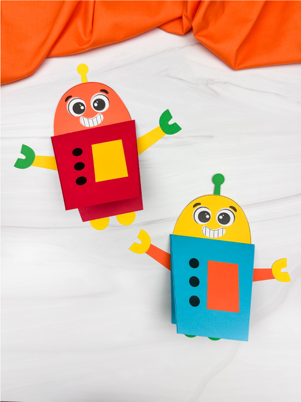 two side by side examples of finished robot card craft