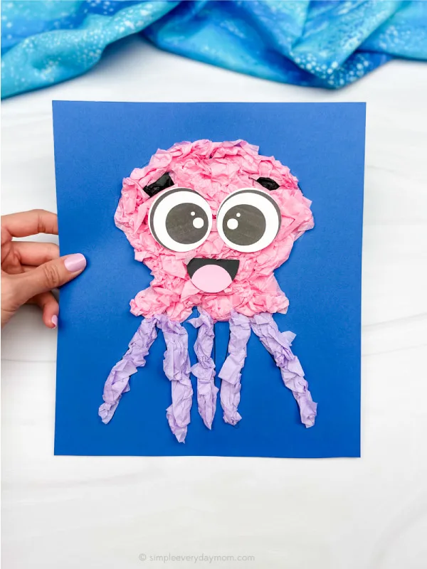 hand holding single image of tissue paper jellyfish