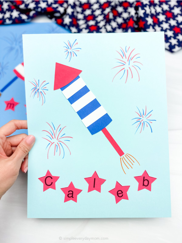hand holding finished patriotic name craft