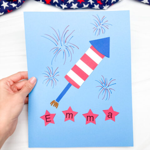 hand holding finished example of patriotic name craft
