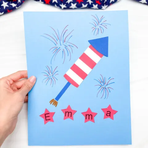 hand holding finished example of patriotic name craft