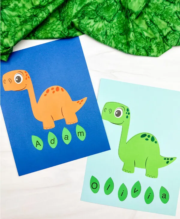 two side by side examples of finished dinosaur name craft