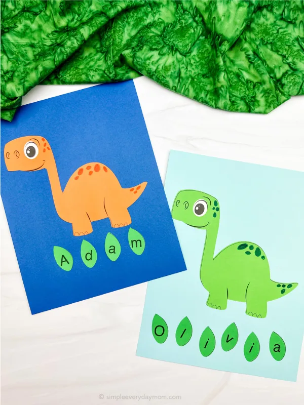 two side by side examples of finished dinosaur name craft