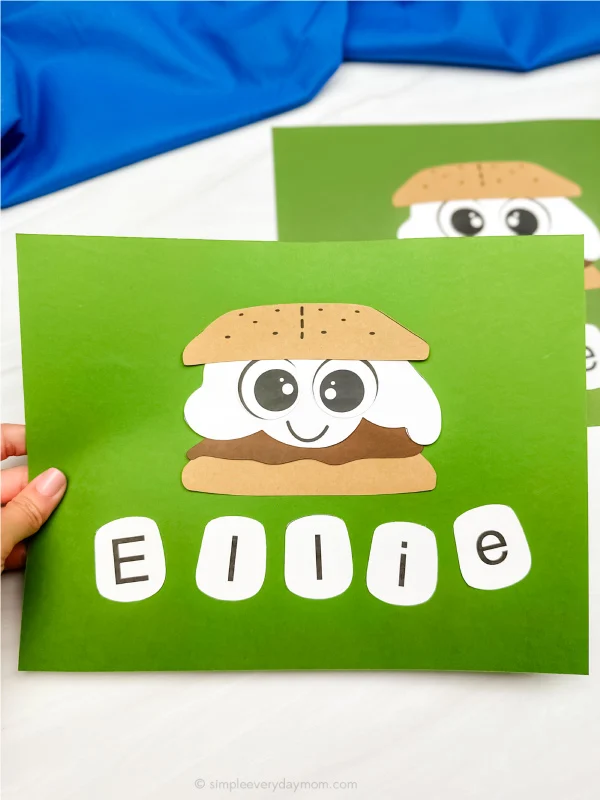 hand holding smore name craft with another example in the background