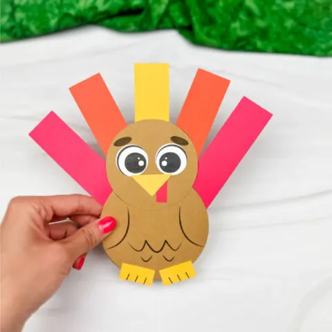 hand holding single example of finished shape turkey craft