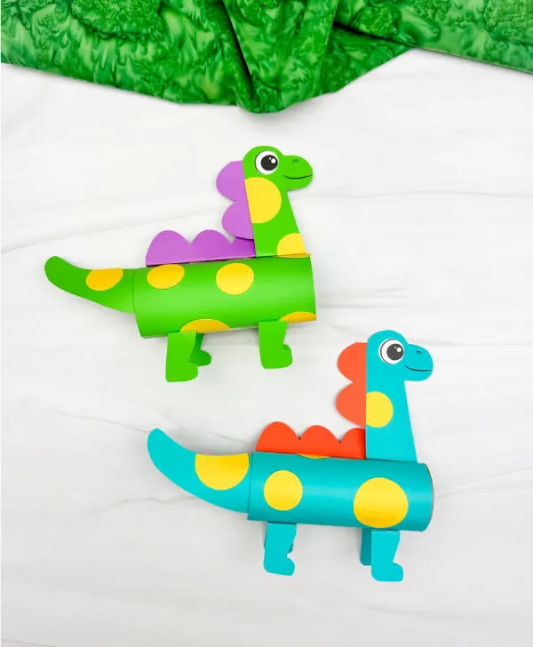 two side by side examples of finished dinosaur craft