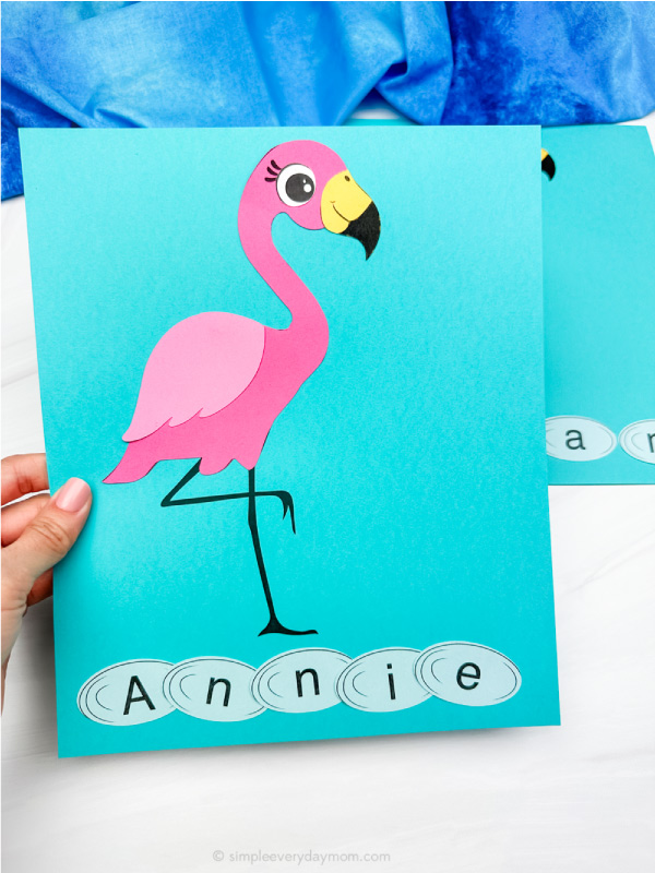 hand holding single example of finished flamingo name craft