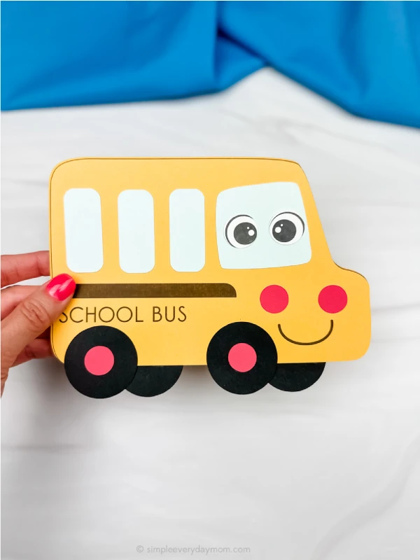 hand holding finished bus craft
