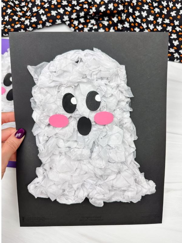 hand holding tissue paper ghost craft