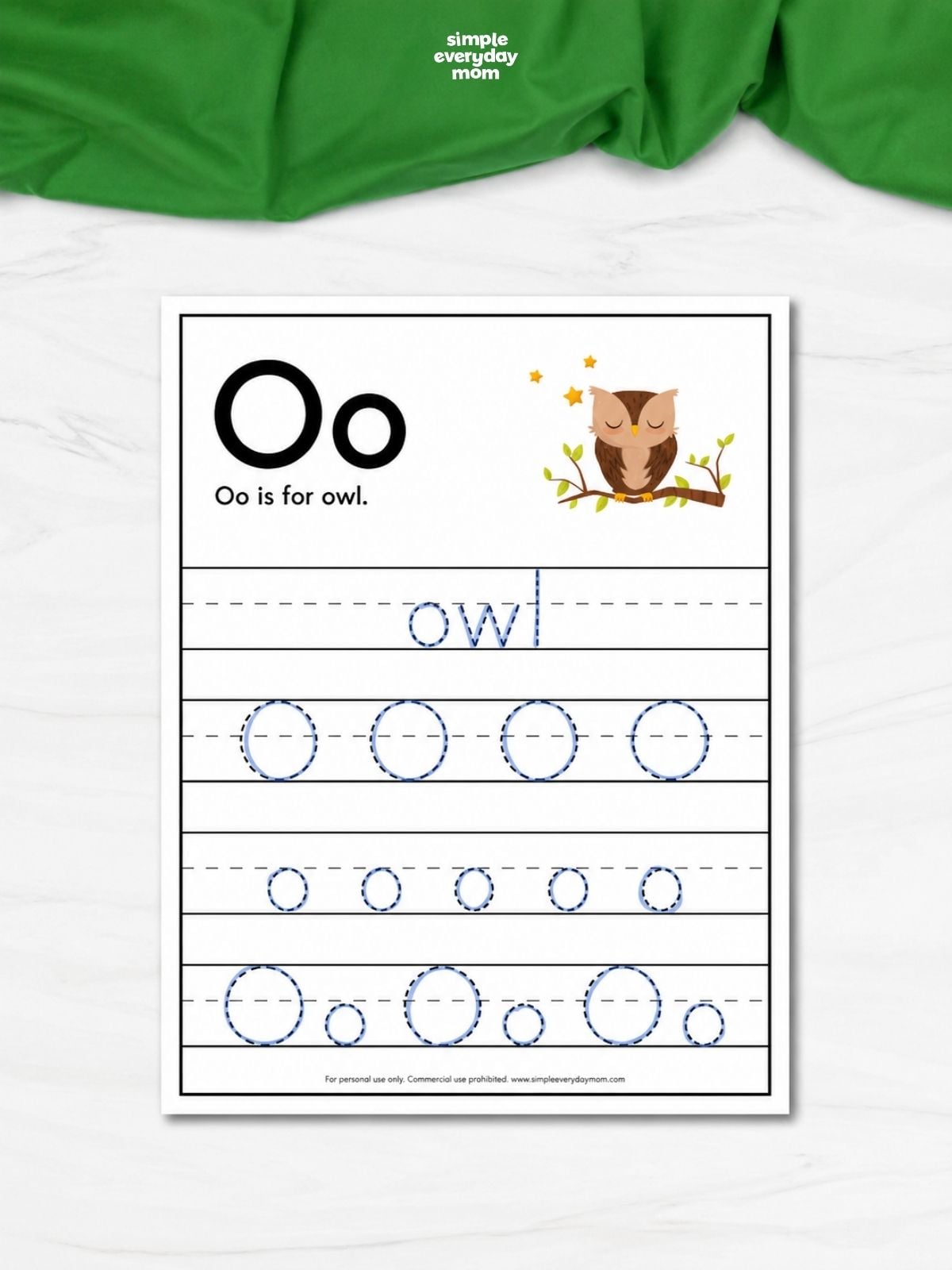 Letter O tracing worksheet with uppercase and lowercase O practice and an owl illustration.