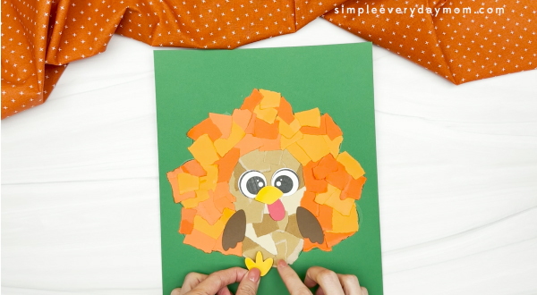 hand gluing the legs of the torn paper turkey craft