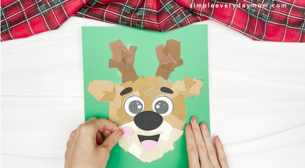 hand gluing the blush effect of face of reindeer craft
