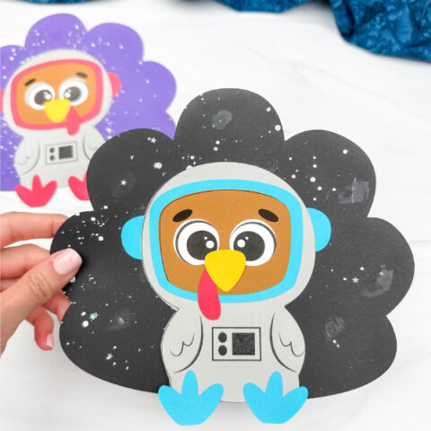 holding the astronaut disguise a turkey craft