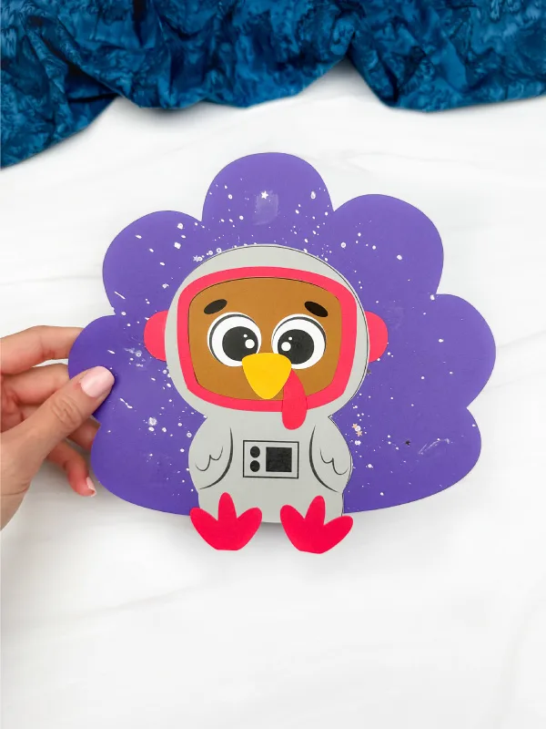 holding the astronaut turkey craft violet feather