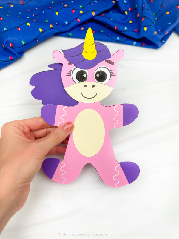 holding the gingerbread disguise unicorn craft