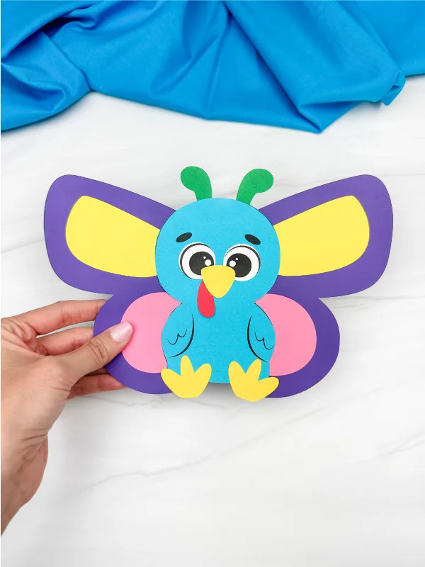holding the image of butterfly disguise turkey craft