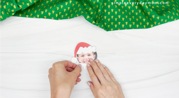 hand gluing the colar of grinch photo craft