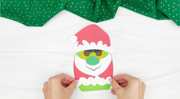 hand gluing the coat grinch gnome craft