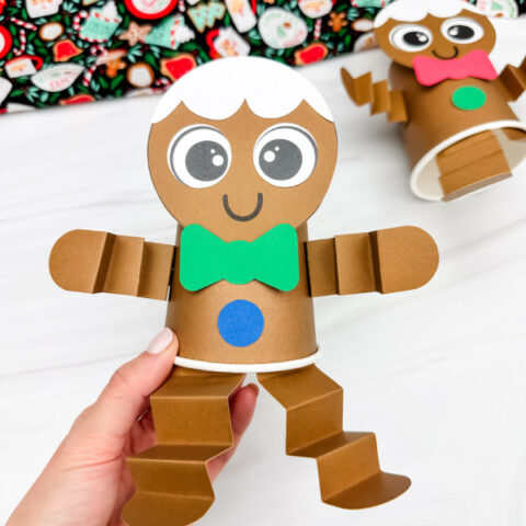 holding the gingerbread paper cup craft green version
