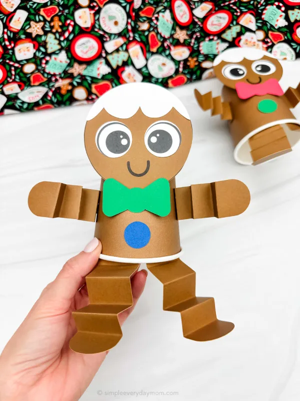 holding the gingerbread paper cup craft green version