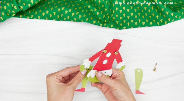 attaching the legs to grinch body