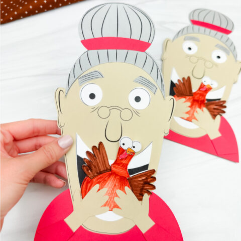 hand holding Old lady who swallowed a turkey craft