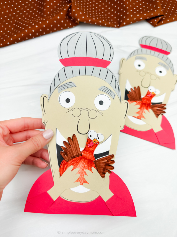 hand holding Old lady who swallowed a turkey craft