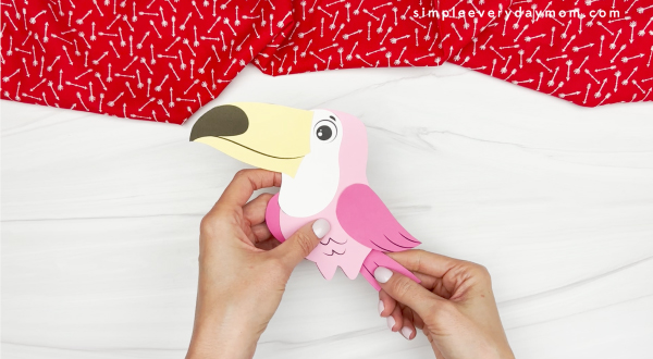 hand gluing the tale of the valentines bird craft