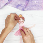 placing the ballerina dress on the bottom of the child photo