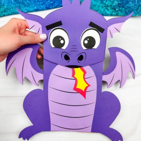 hand holding the dragon puppet craft
