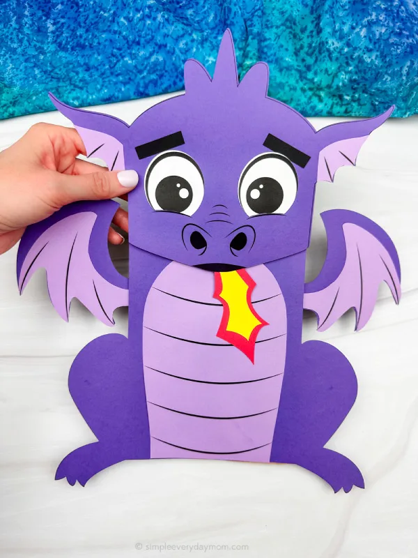 hand holding the dragon puppet craft