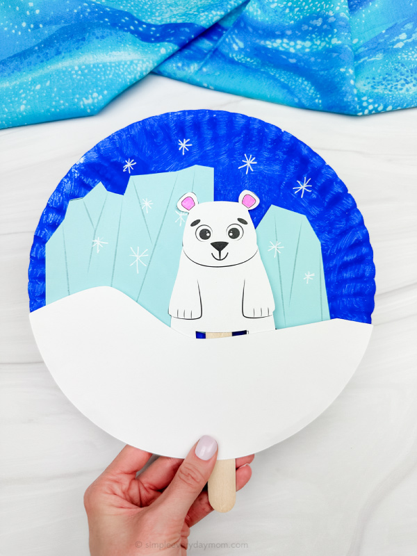 holding the polar bear paper plate craft