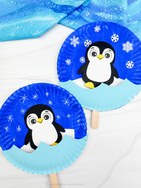 double image of moving penguin paper plate craft side by side