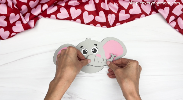 hand gluing the trunk of elephant valentine craft