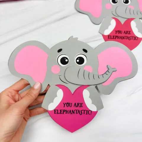 holding the elephant valentine craft with background craft
