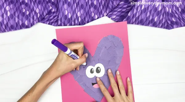 drawing the eyebrows of torn paper heart craft