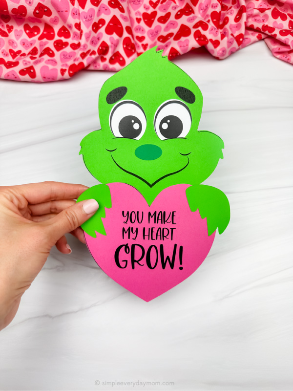 holding the grinch valentines day craft