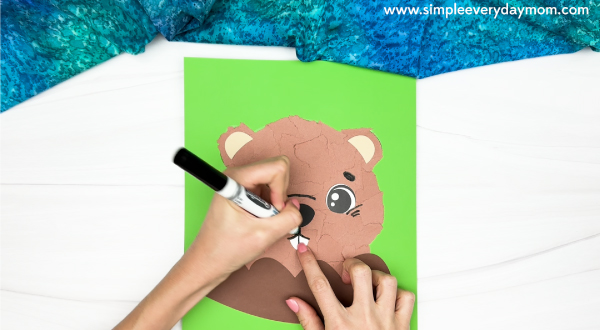 hand drawing the mouth of the torn paper groundhog craft