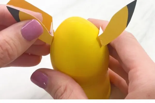The Pokémon Easter egg's ears are being attached.