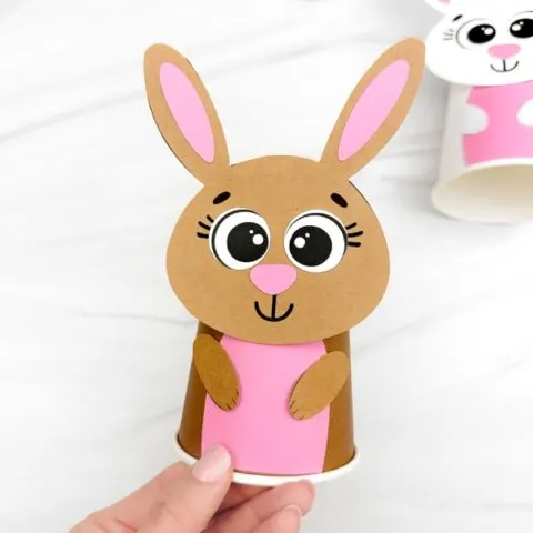 hand holding single example finished Bunny Paper Cup Craft template