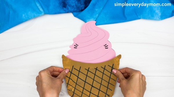 hand gluing the cone paper plate ice cream craft template