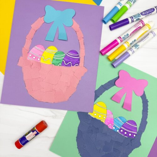 Two completed torn paper Easter basket crafts on colorful backgrounds, surrounded by markers, construction paper, and a glue stick—perfect for a fun and creative kids’ activity.