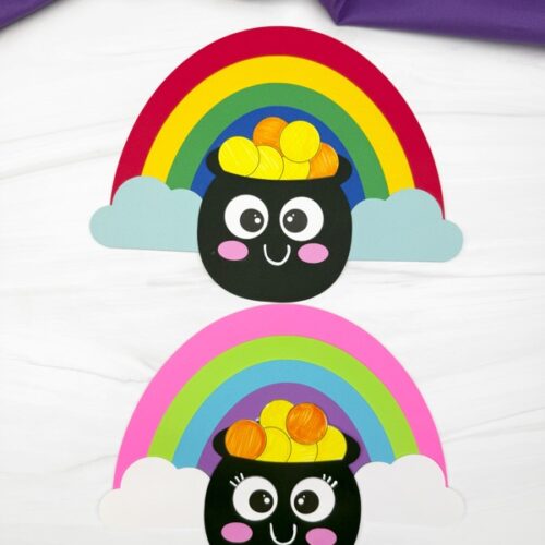 Two colorful pot of gold crafts with smiling faces, rainbows, and fluffy clouds, perfect for a fun St. Patrick’s Day activity for kids.