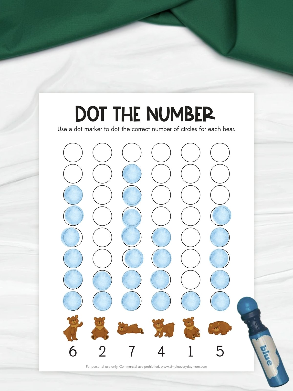 The image shows a “Dot the Number” worksheet featuring rows of empty circles to be filled in with a dot marker. Some circles are already marked in blue to represent counting for each bear shown at the bottom. A blue dot marker sits beside the page, emphasizing the interactive counting activity for young children.