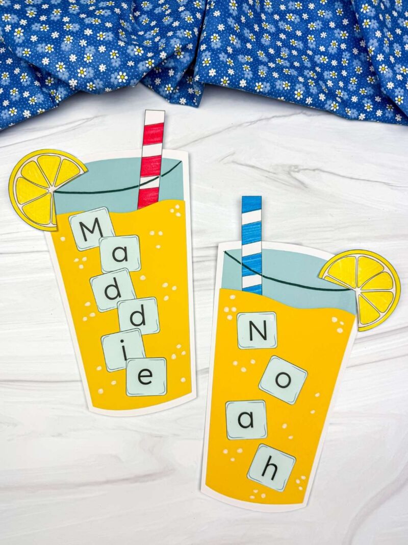 A completed craft showing two lemonade name crafts with paper cups, straws, lemon slices, and the names Maddie and Noah spelled out